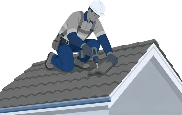 A roofer fixing tiles on a pitched roof